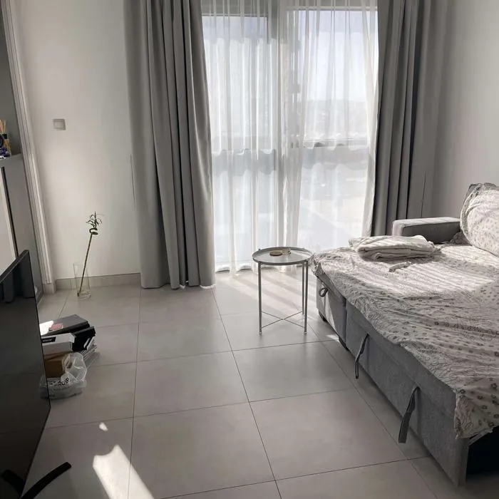 Grey blackout curtains fitted in a Dubai bedroom