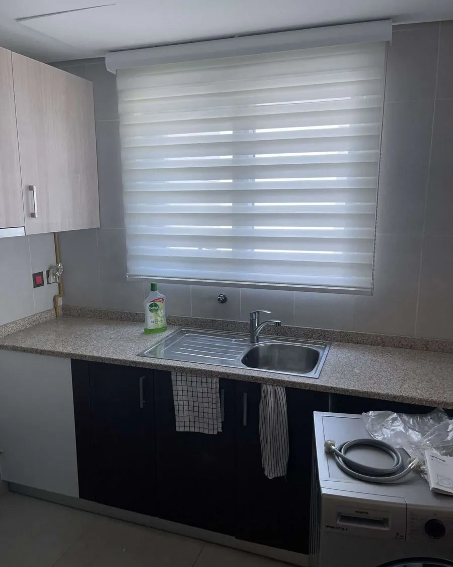 Zebra day-night blind installed over a kitchen window in Dubai